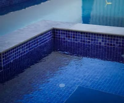 Completed pool with blue mosaic tiling